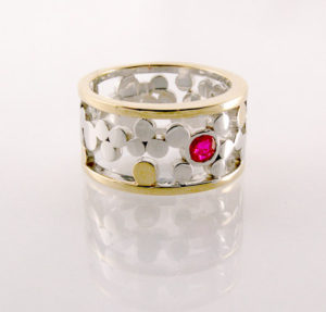 Ring of Circles, 10K white and yellow gold with ruby
